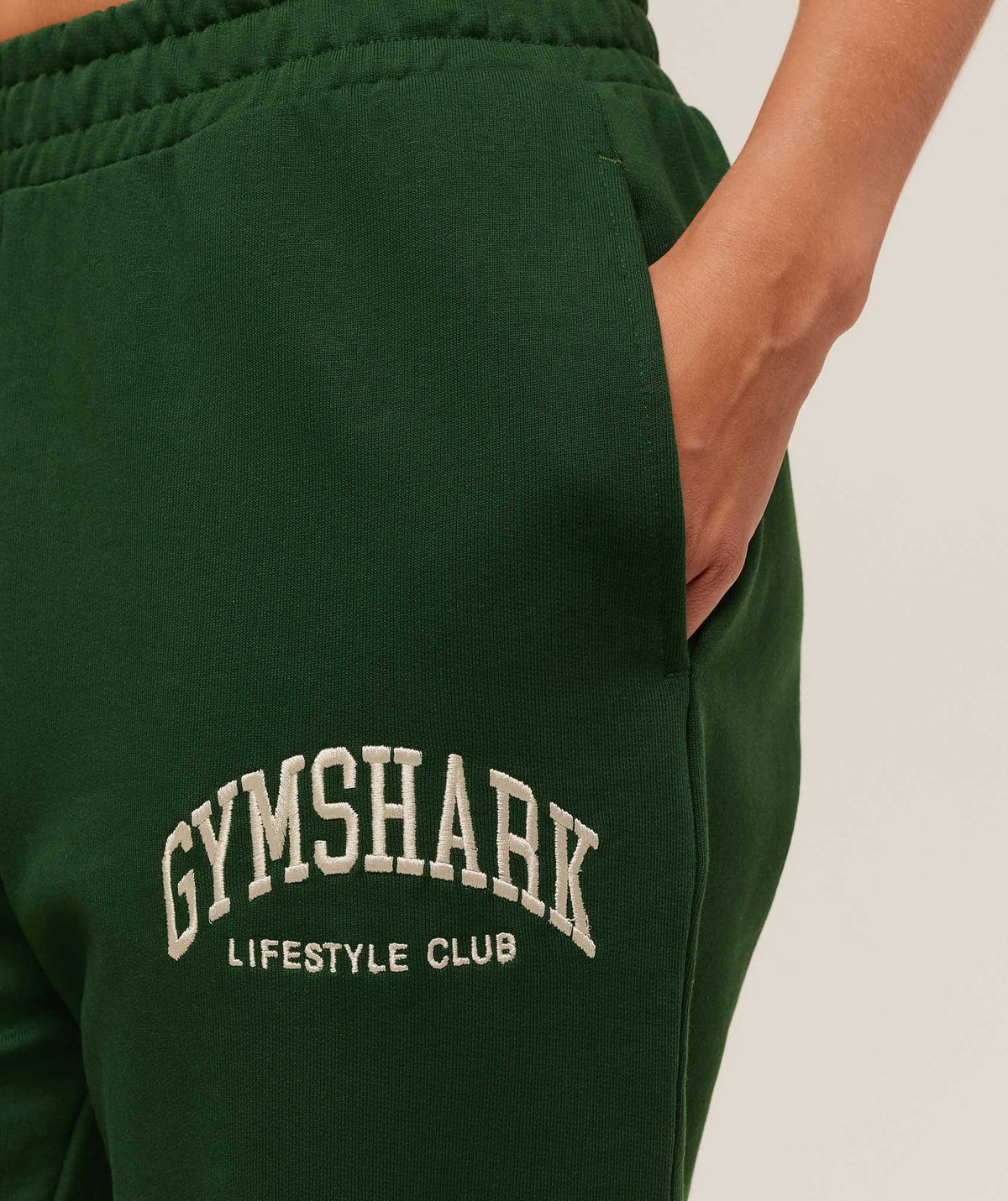 gymshark-collegiate-graphic-joggers-pants-green-aw25