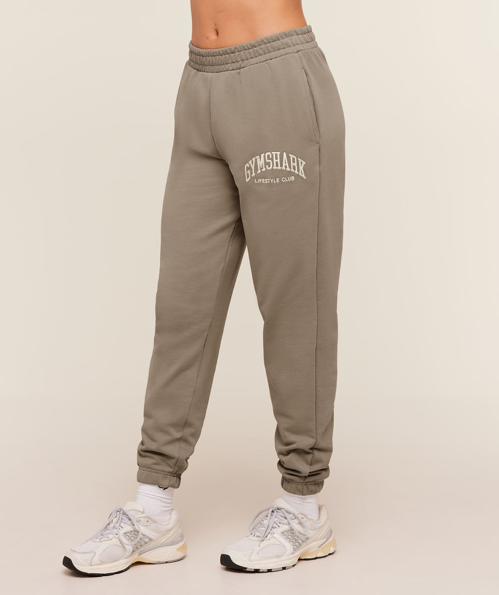 gymshark-collegiate-graphic-joggers-pants-brown-aw25