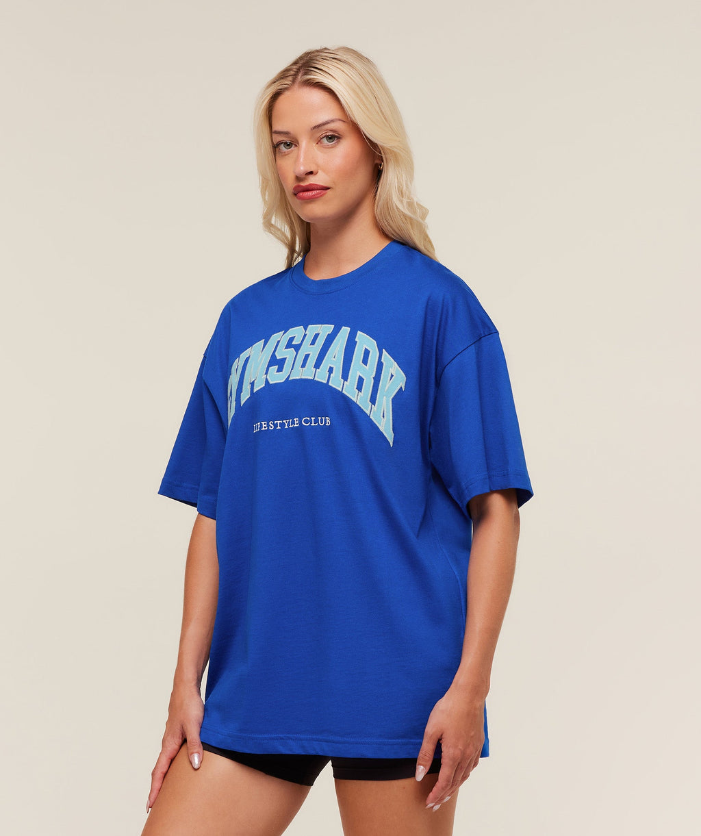 gymshark-collegiate-graphic-t-shirt-ss-tops-blue-aw25