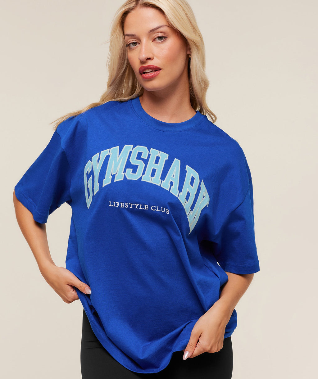 gymshark-collegiate-graphic-t-shirt-ss-tops-blue-aw25