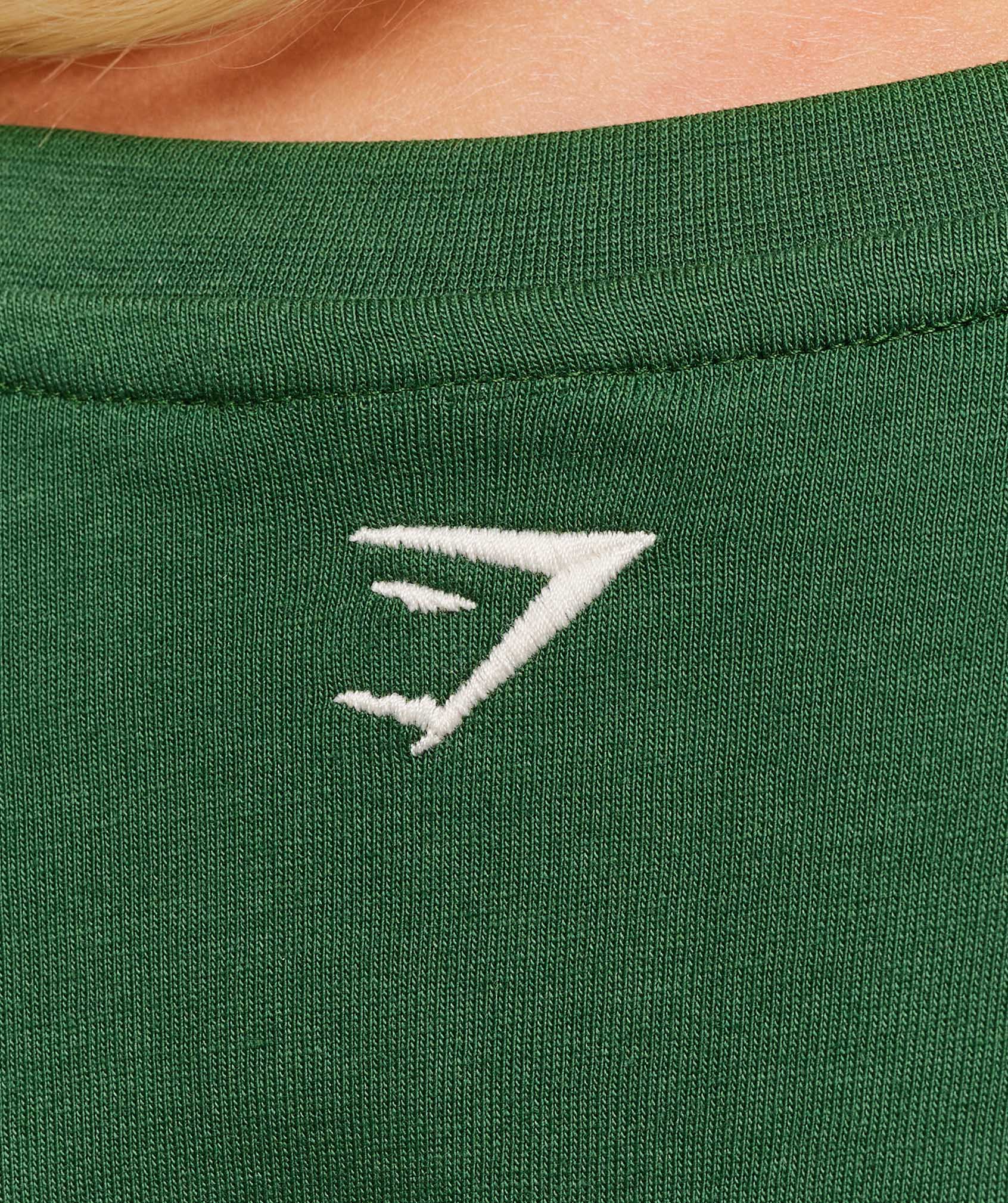 gymshark-collegiate-graphic-t-shirt-ss-tops-green-aw25