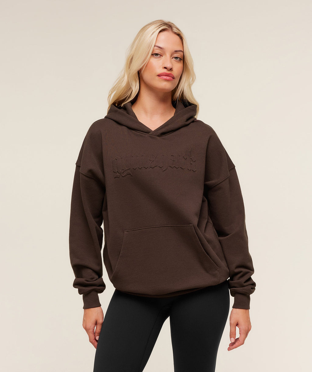 gymshark-embossed-graphic-oversized-hoodie-pullovers-brown-aw25