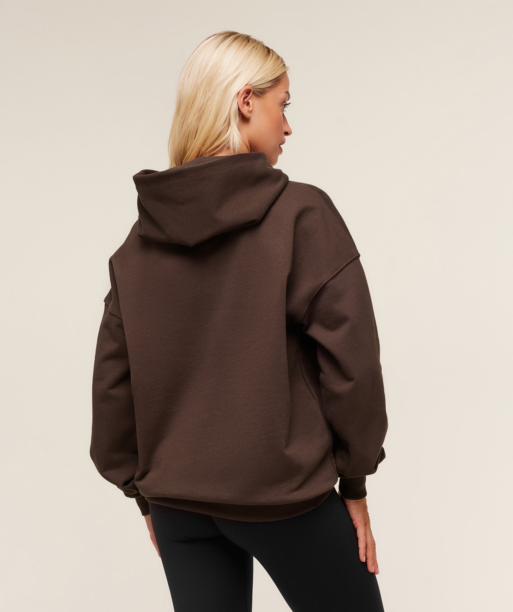 gymshark-embossed-graphic-oversized-hoodie-pullovers-brown-aw25