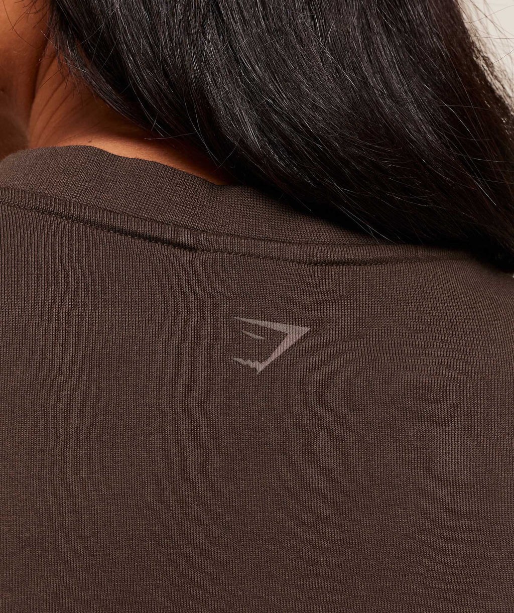 gymshark-embossed-graphic-oversized-t-shirt-ss-tops-brown-aw25