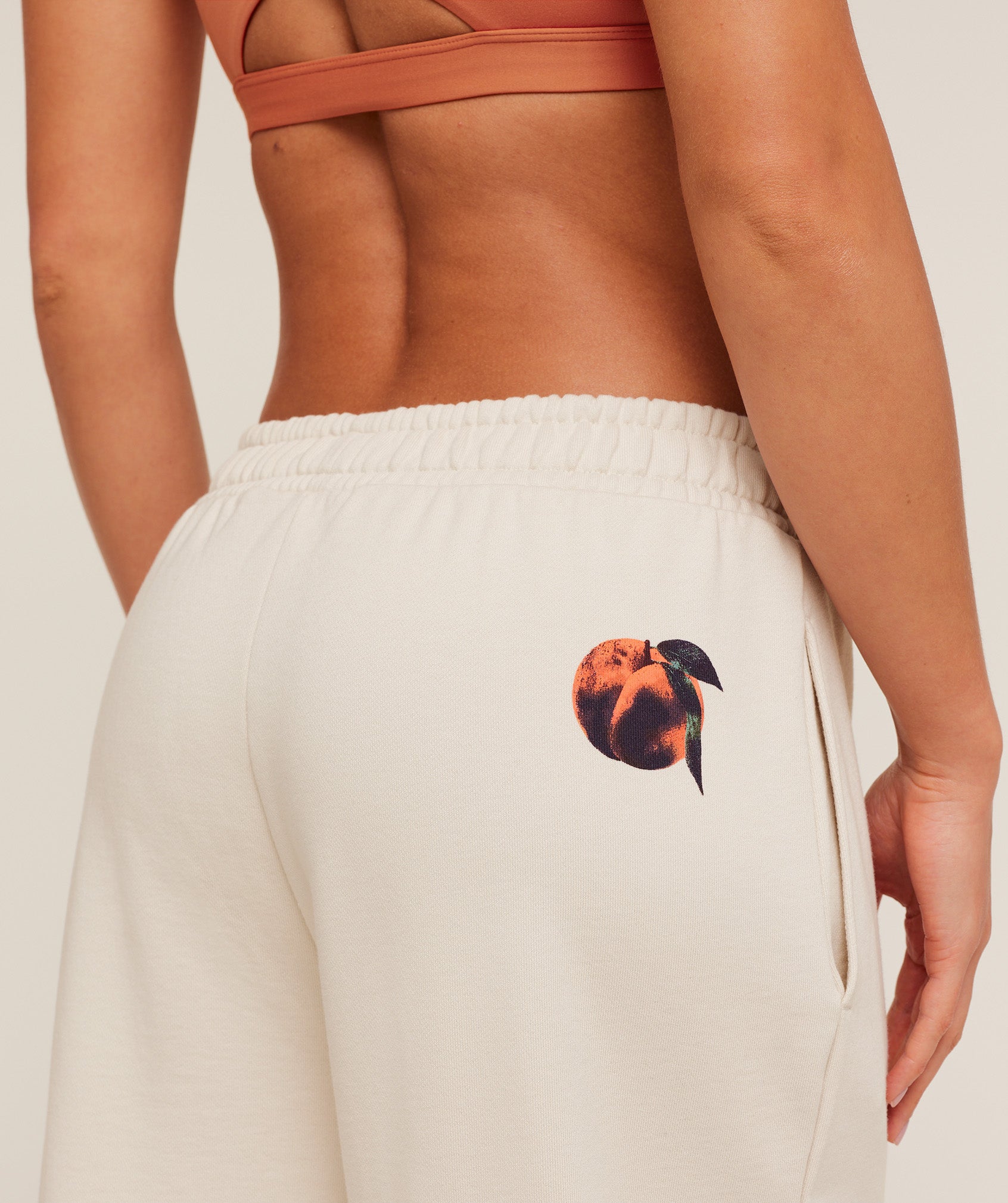 gymshark-juice-peach-wide-leg-joggers-pants-white-aw25