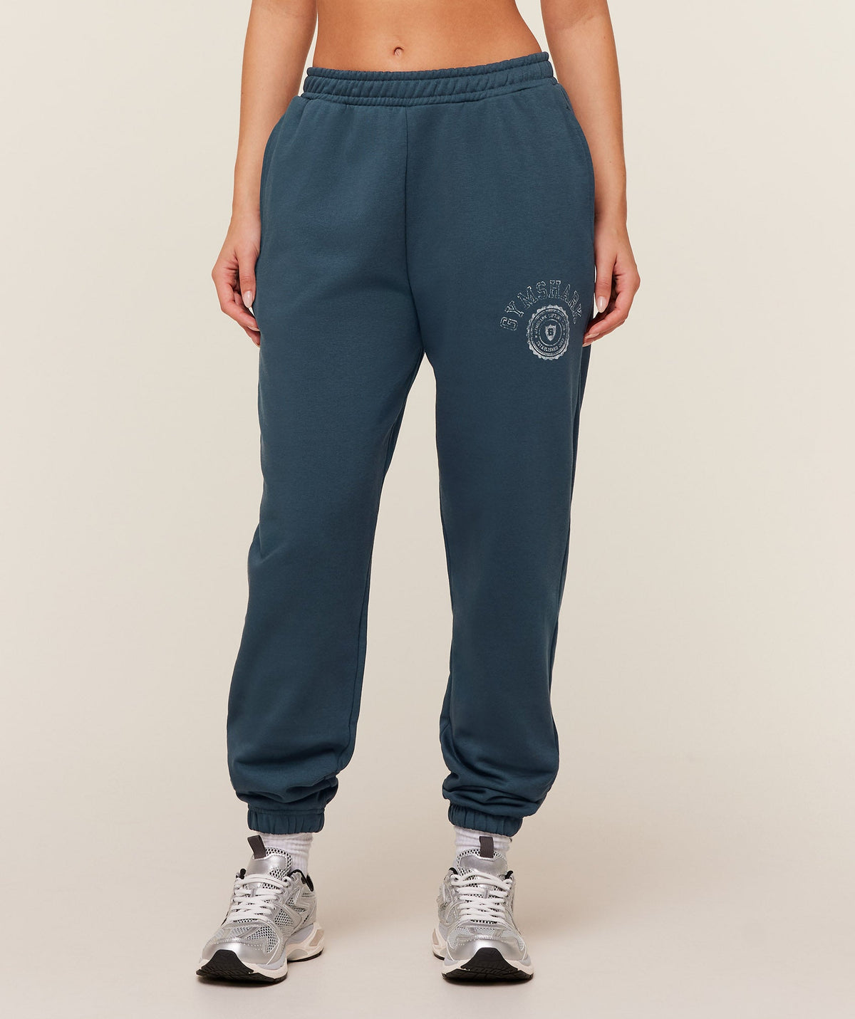 gymshark-worn-crest-graphic-jogger-pants-blue-ss26