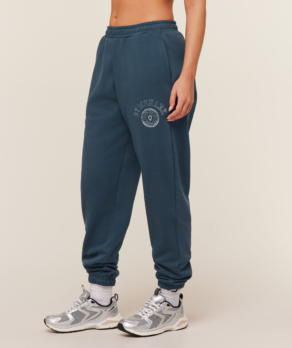 gymshark-worn-crest-graphic-jogger-pants-blue-ss26