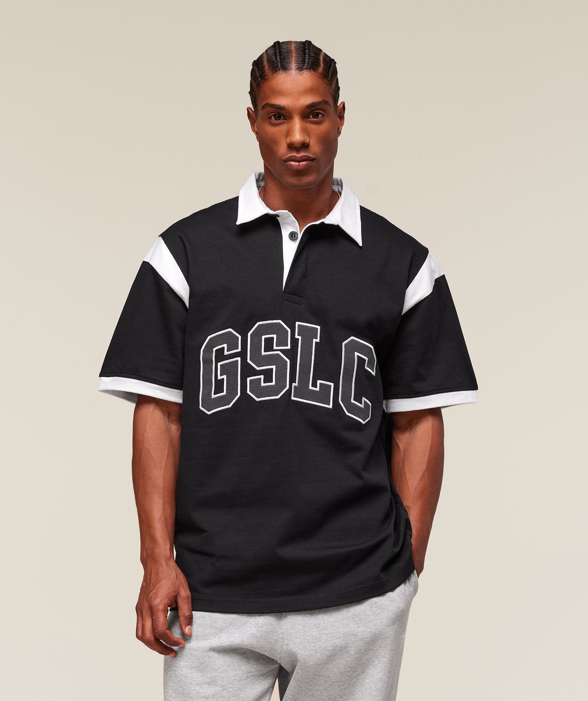 gymshark-collegiate-retro-polo-shirt-ss-tops-black-ss25