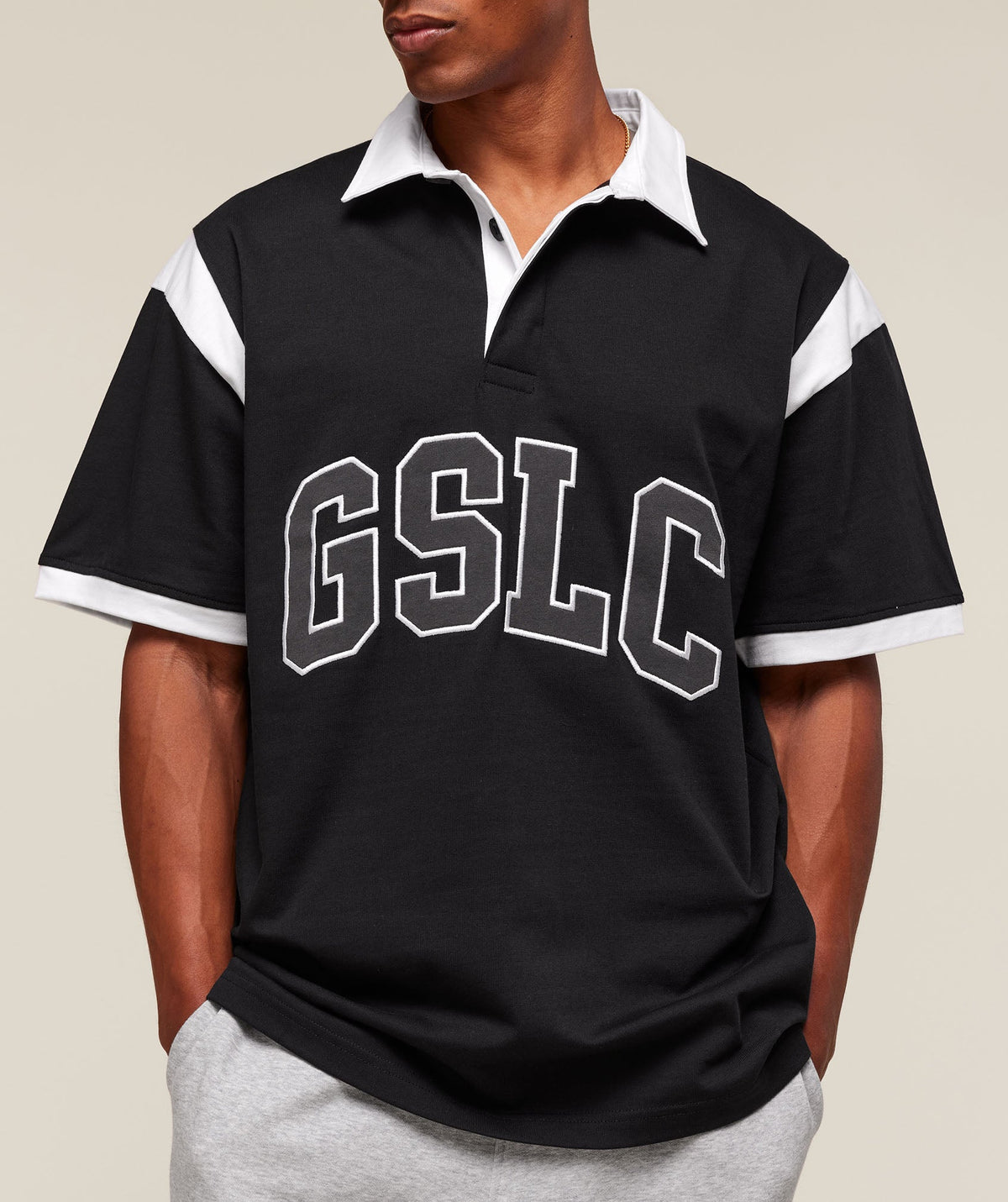 gymshark-collegiate-retro-polo-shirt-ss-tops-black-ss25