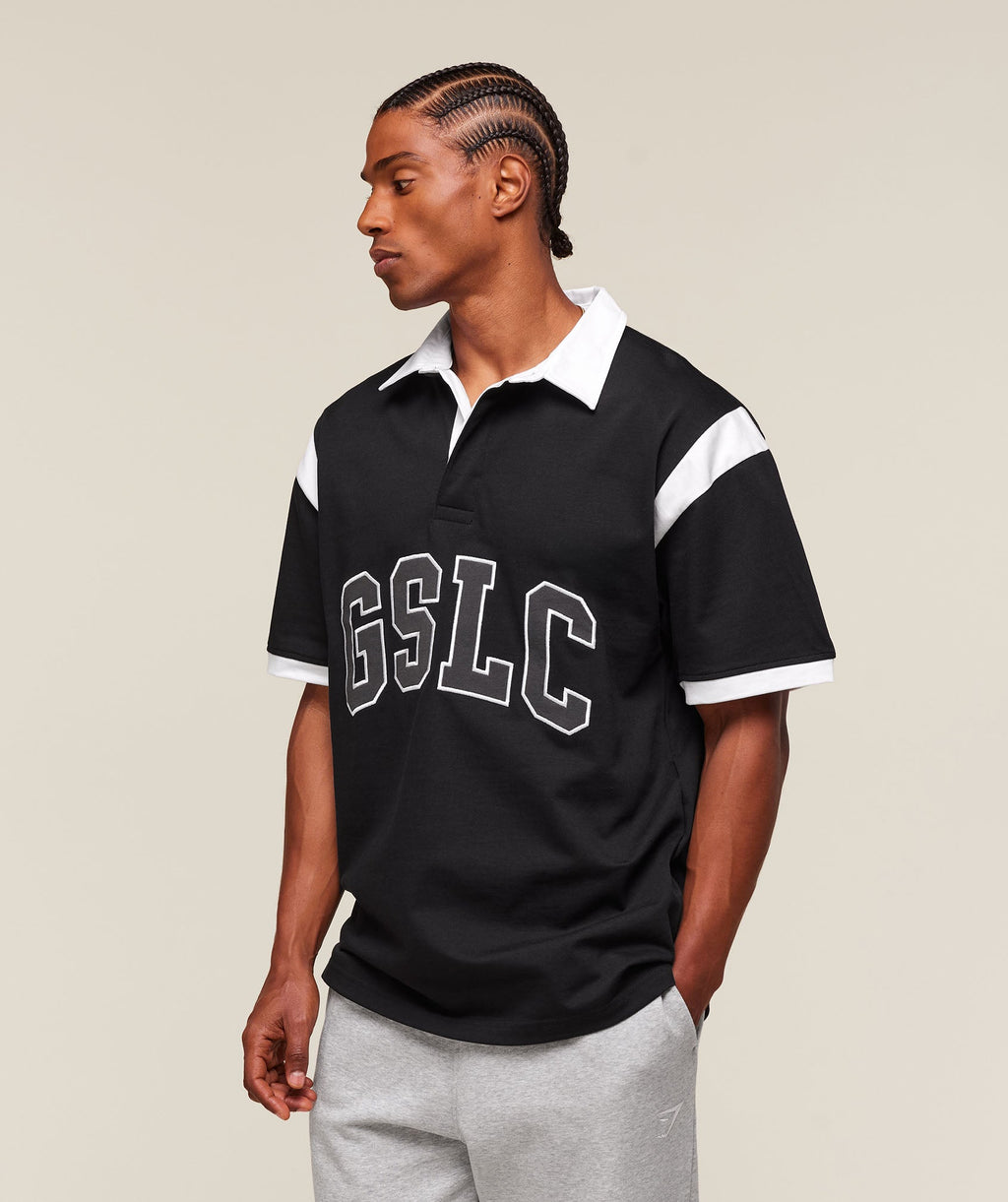 gymshark-collegiate-retro-polo-shirt-ss-tops-black-ss25
