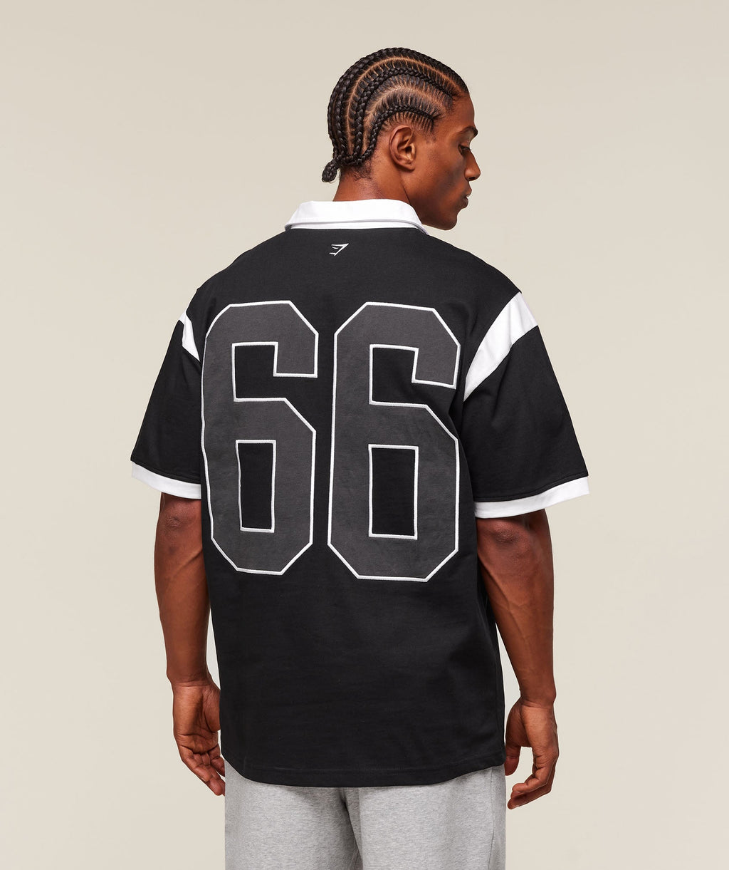 gymshark-collegiate-retro-polo-shirt-ss-tops-black-ss25