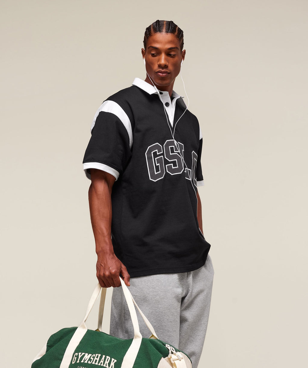 gymshark-collegiate-retro-polo-shirt-ss-tops-black-ss25