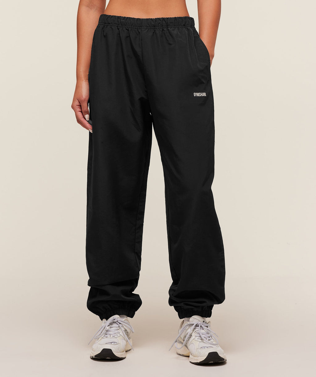 gymshark-woven-track-pant-pants-black-aw25