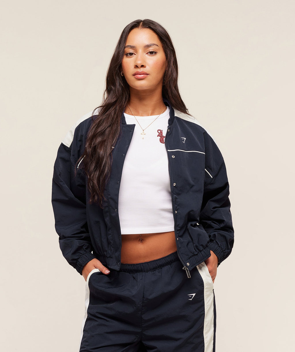 gymshark-gymshark-x-analis-woven-track-jacket-jackets-outerwear-blue-aw25