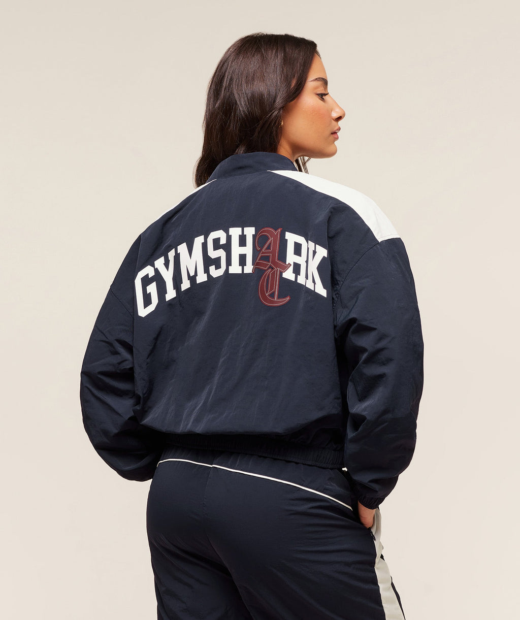gymshark-gymshark-x-analis-woven-track-jacket-jackets-outerwear-blue-aw25
