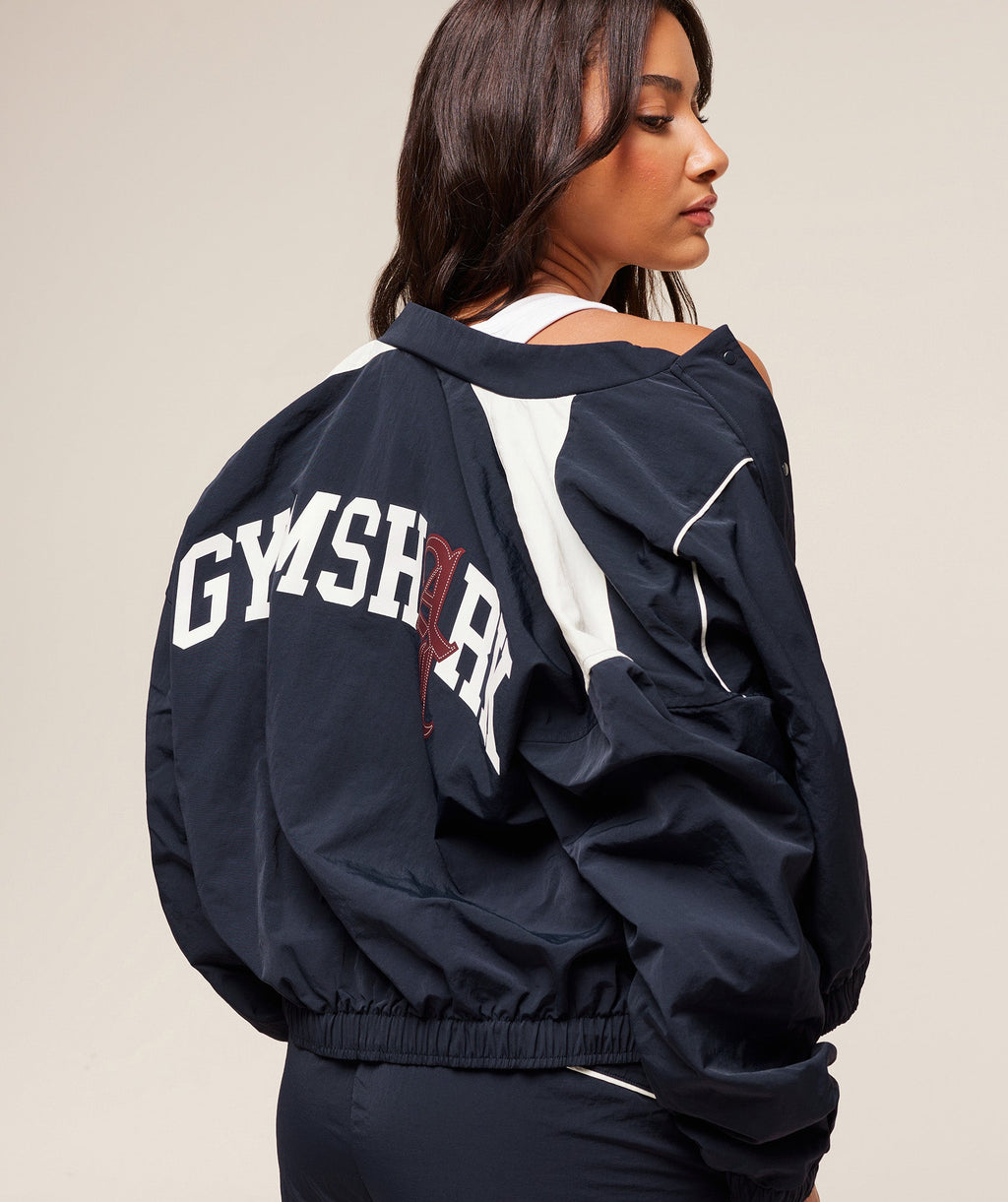 gymshark-gymshark-x-analis-woven-track-jacket-jackets-outerwear-blue-aw25