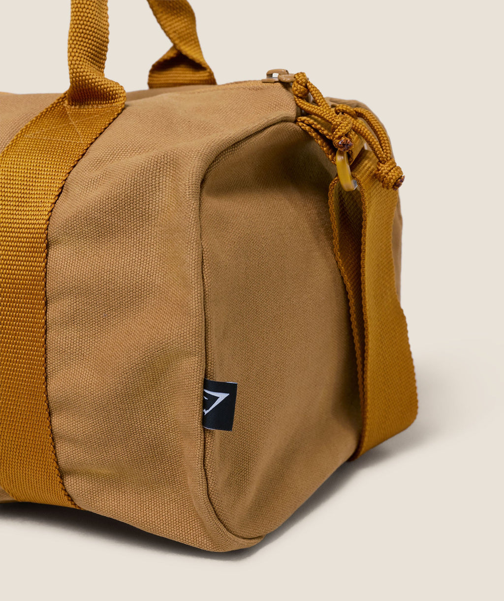gymshark-strength-dept-mini-canvas-duffle-bag-bags-yellow-aw25