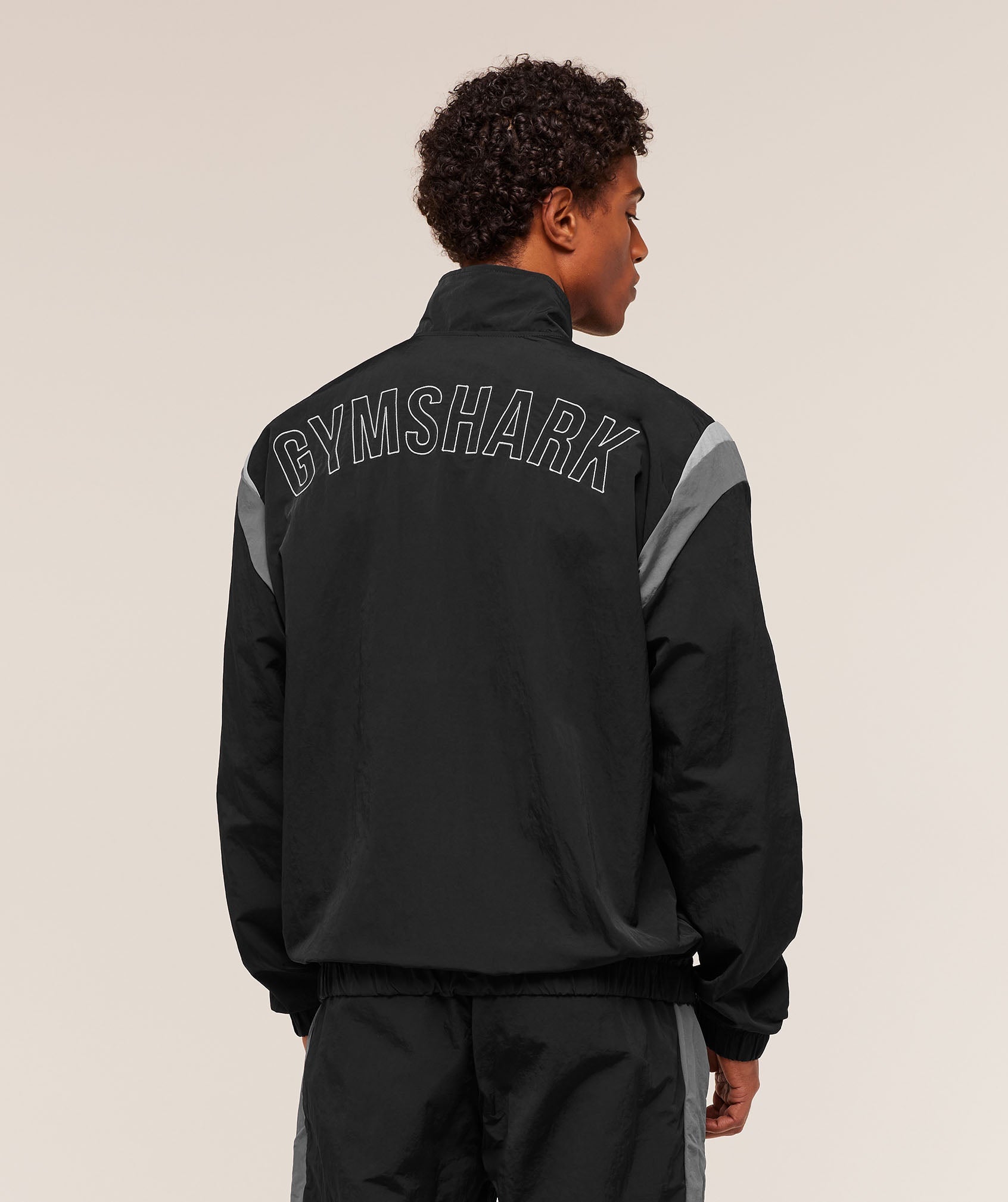 gymshark-retro-track-jacket-black-dark-grey-smokey-grey-aw24