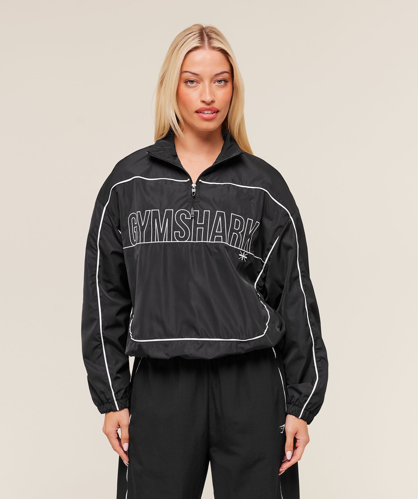 gymshark-wordmark-1-4-zip-track-jacket-jackets-outerwear-black-aw25