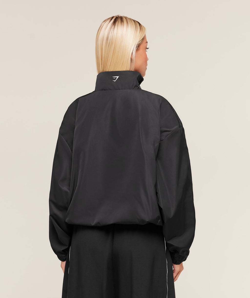 gymshark-wordmark-1-4-zip-track-jacket-jackets-outerwear-black-aw25