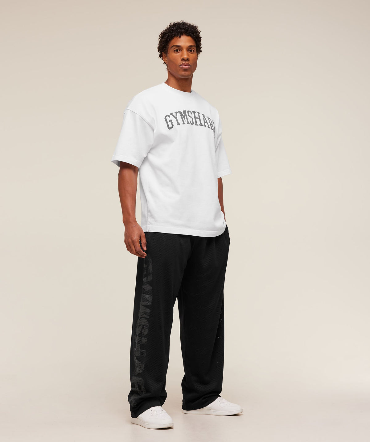 gymshark-graphic-wordmark-mesh-wide-leg-pants-pants-black-aw25