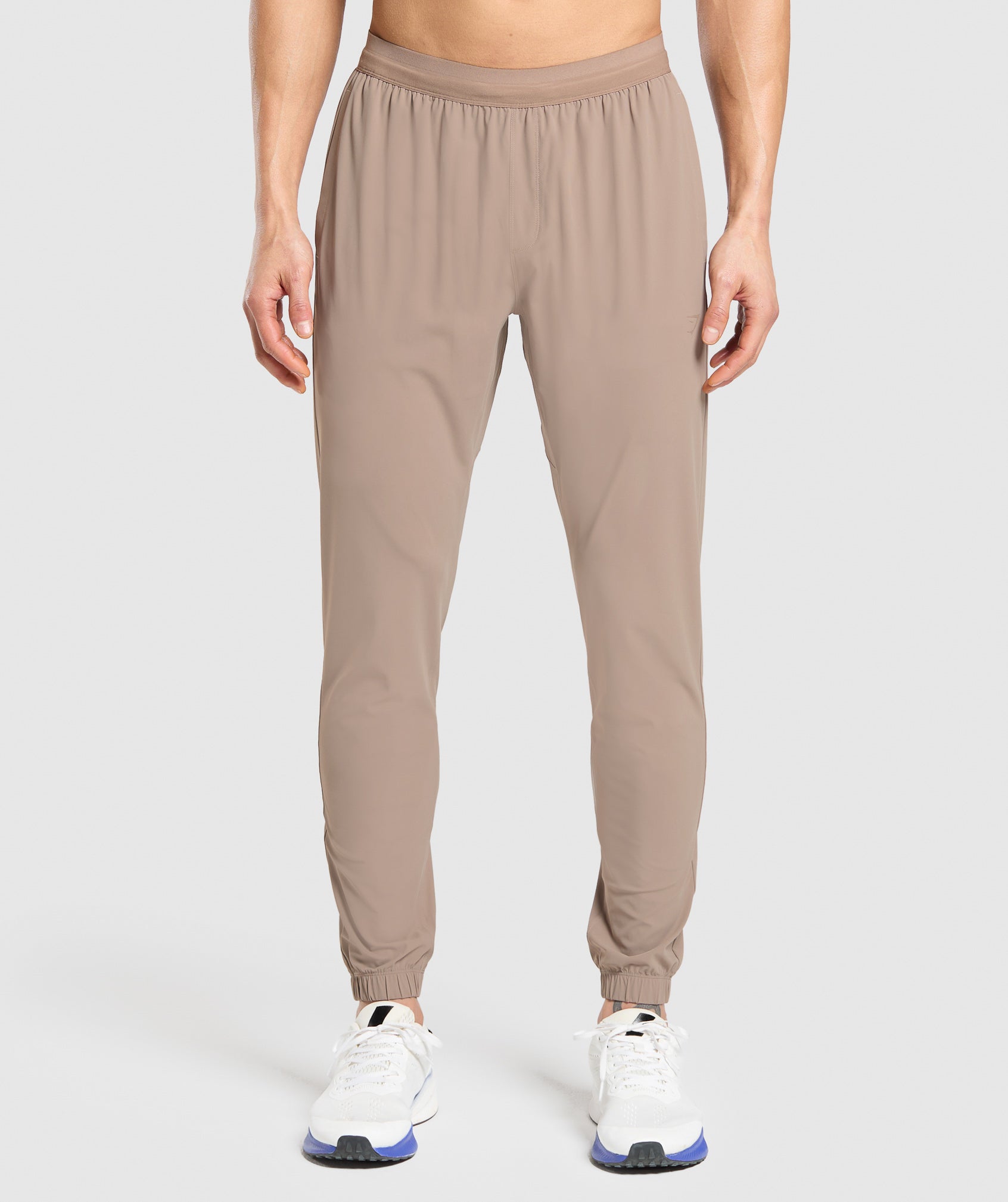 gymshark-studio-joggers-pants-brown-ss25