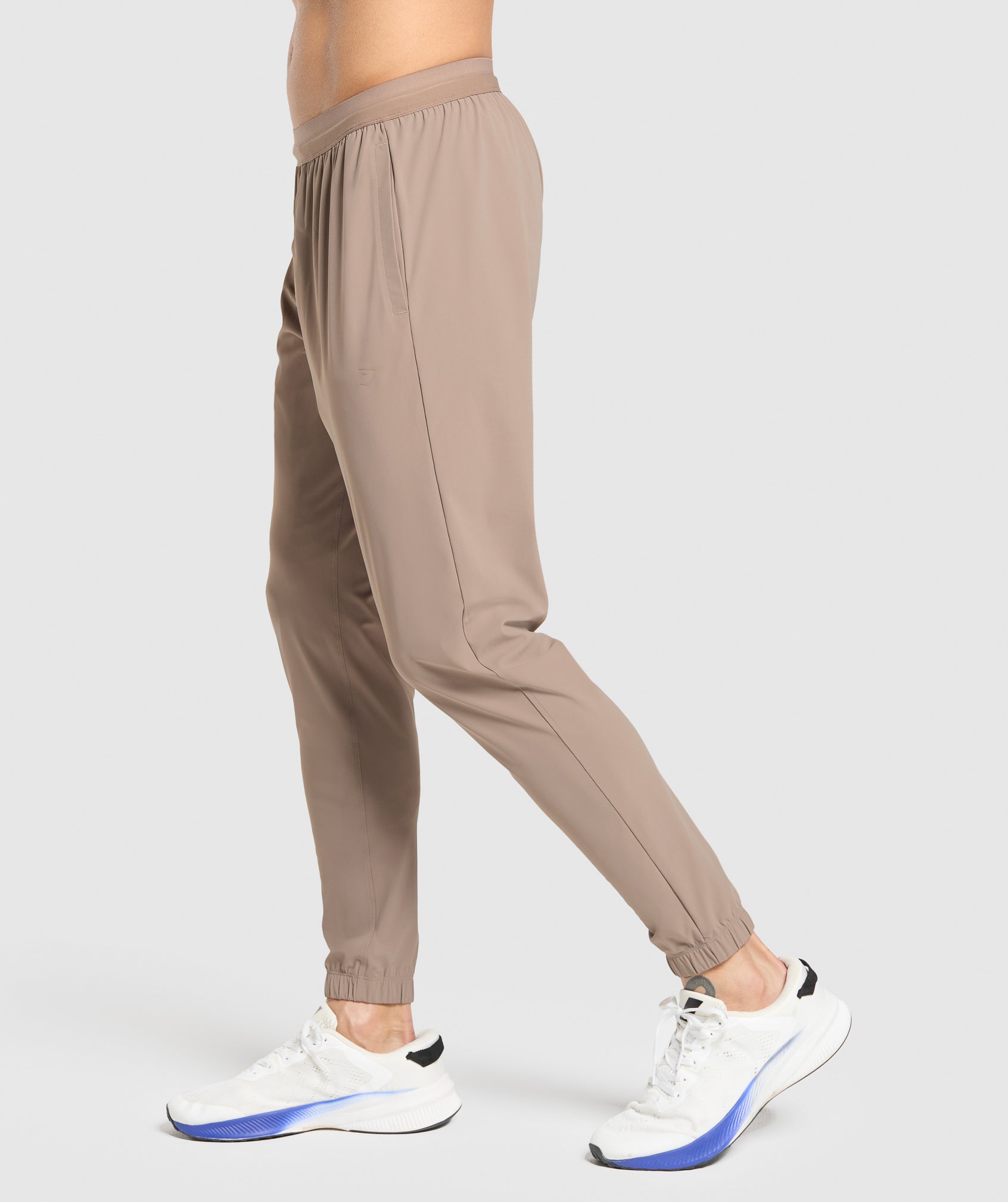 gymshark-studio-joggers-pants-brown-ss25