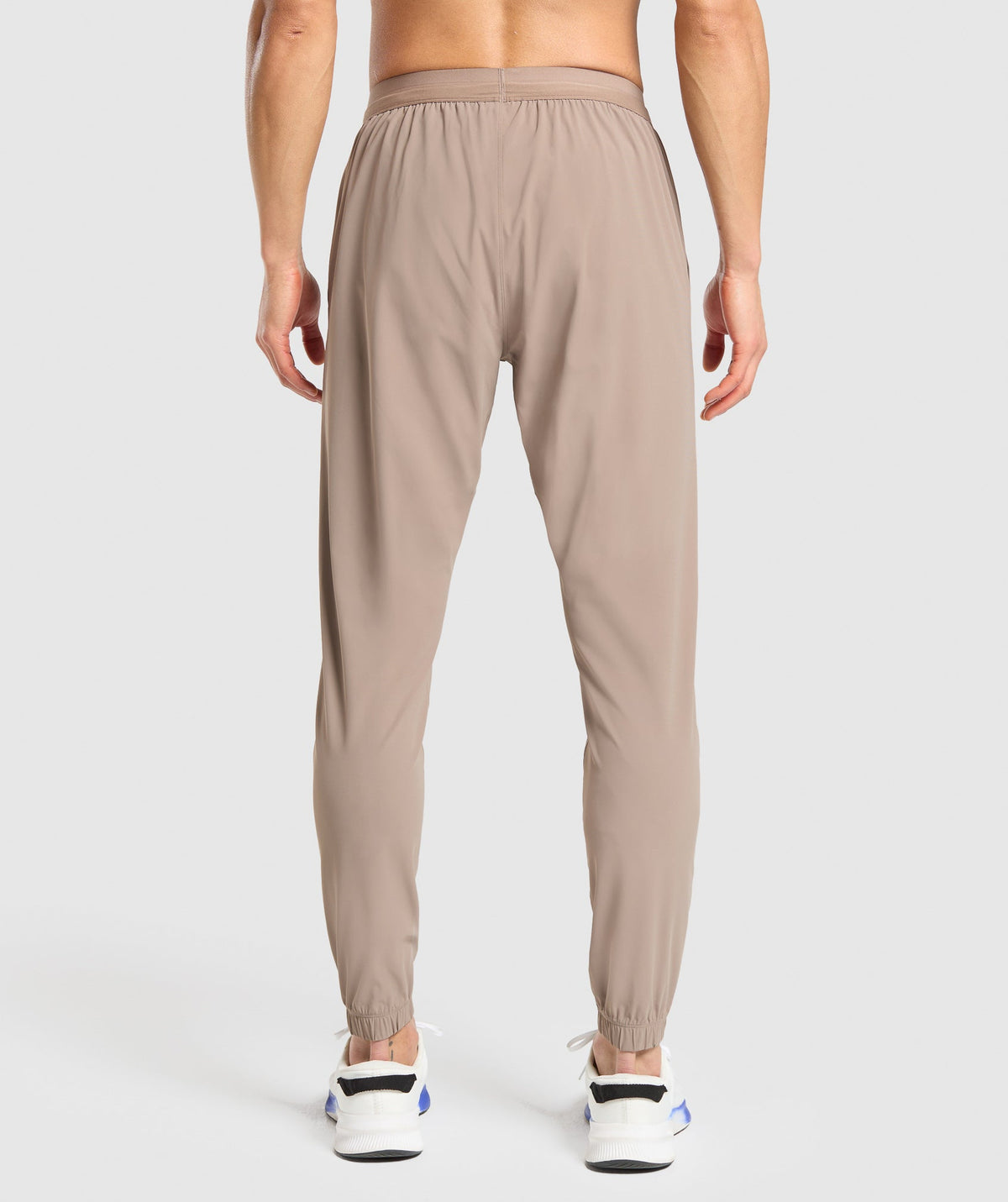 gymshark-studio-joggers-pants-brown-ss25