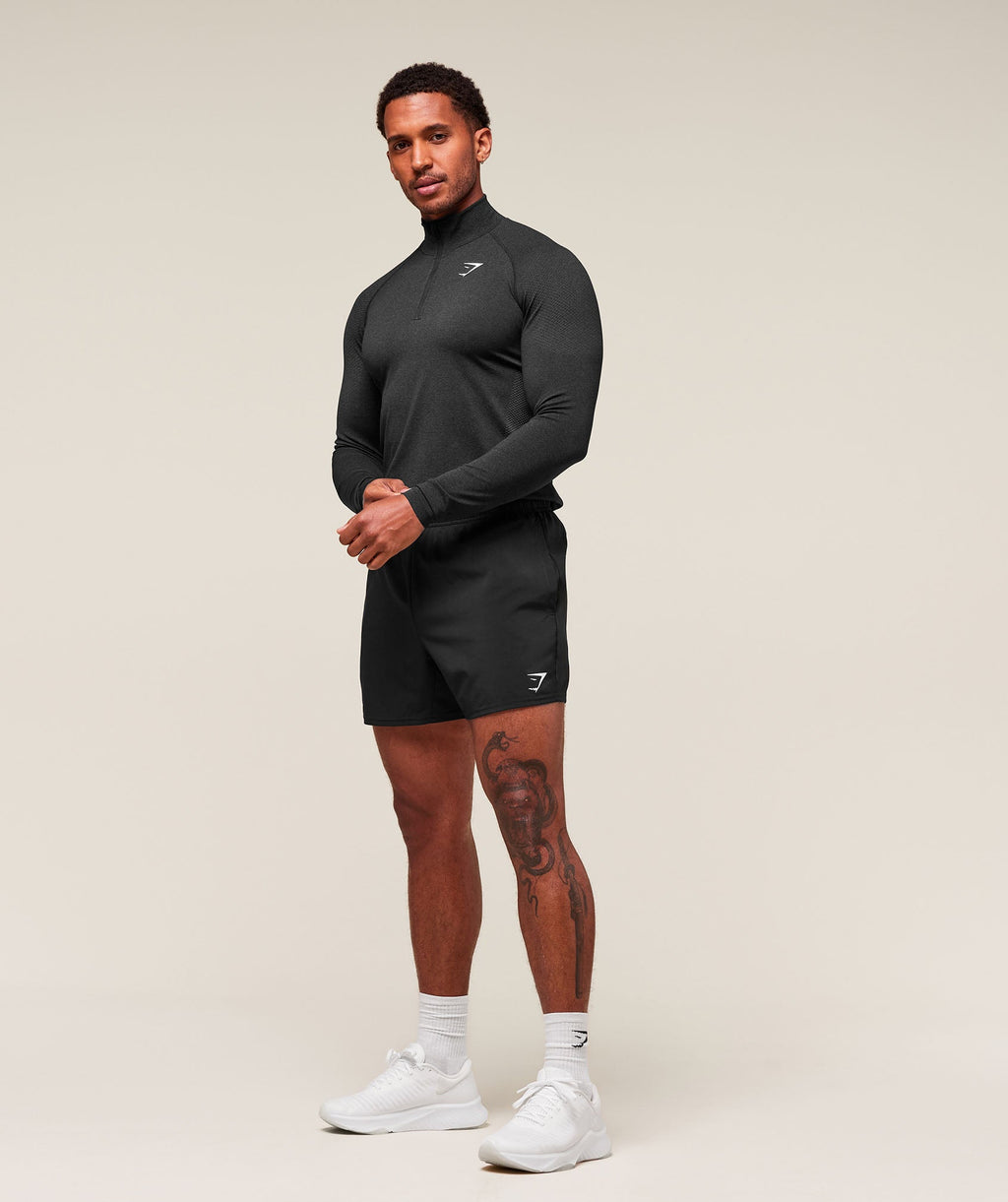gymshark-vital-seamless-1-4-zip-black-silhouette-grey-aw22