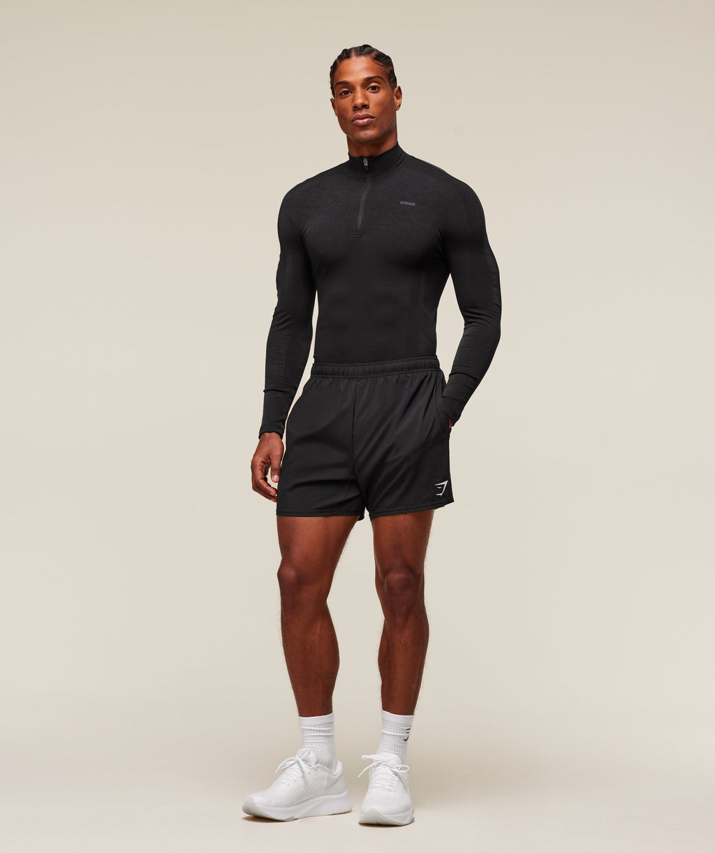 gymshark-everywear-warp-knit-polo-1-4-zip-ls-tops-black-ss24
