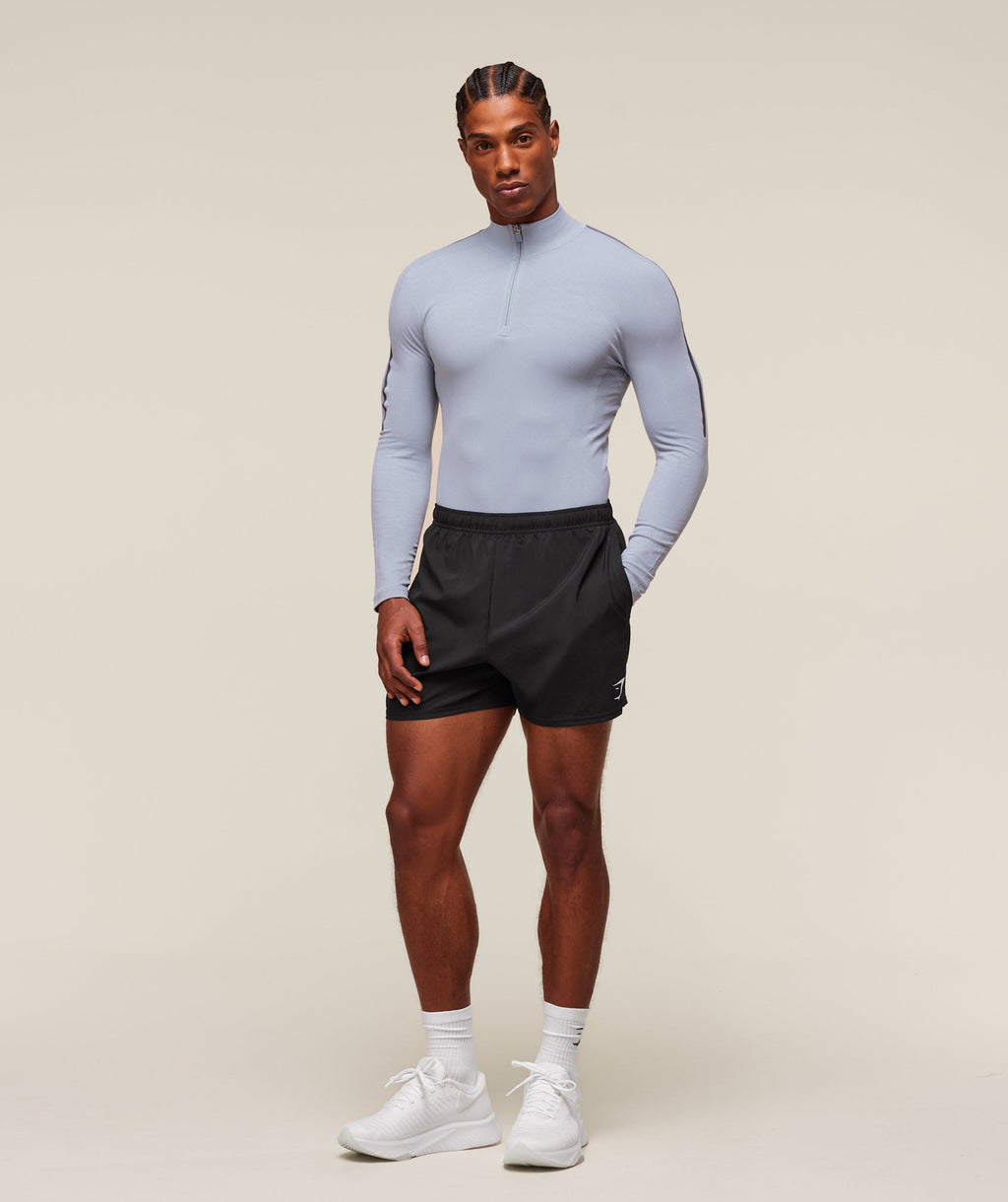 gymshark-everywear-warp-knit-polo-1-4-zip-ls-tops-blue-ss24