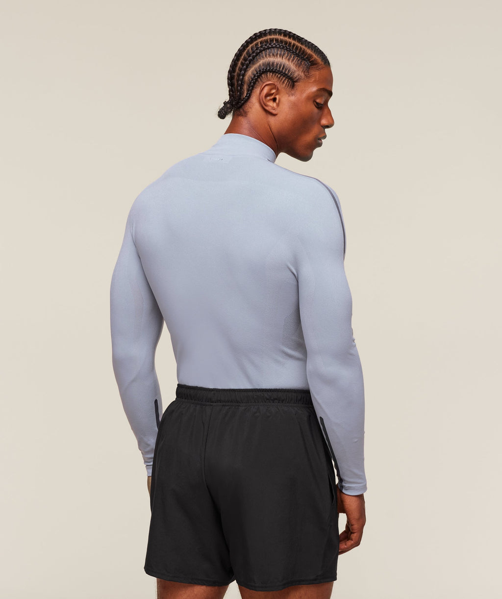 gymshark-everywear-warp-knit-polo-1-4-zip-ls-tops-blue-ss24