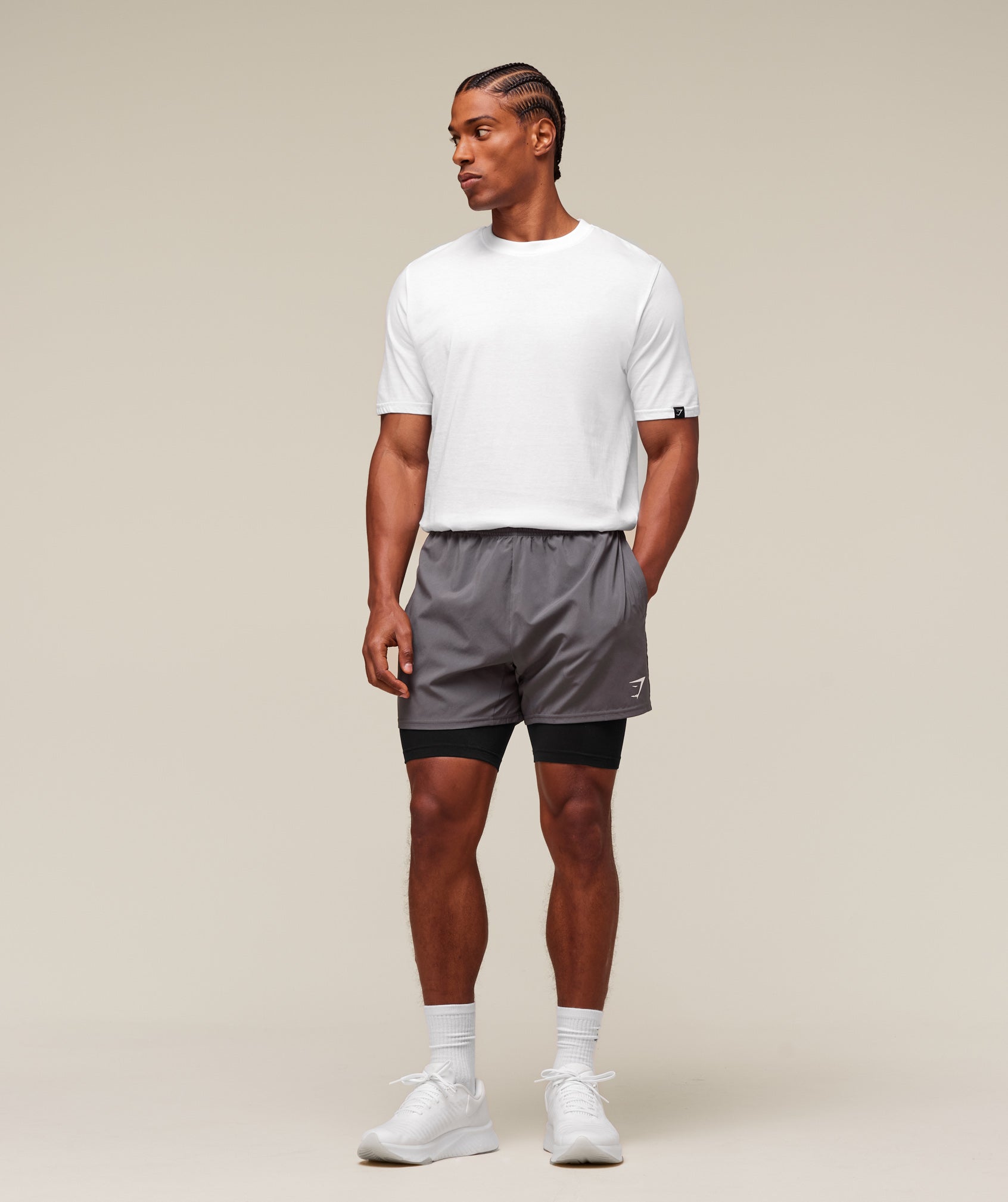 gymshark-everywear-warp-knit-half-tight-shorts-black-ss24